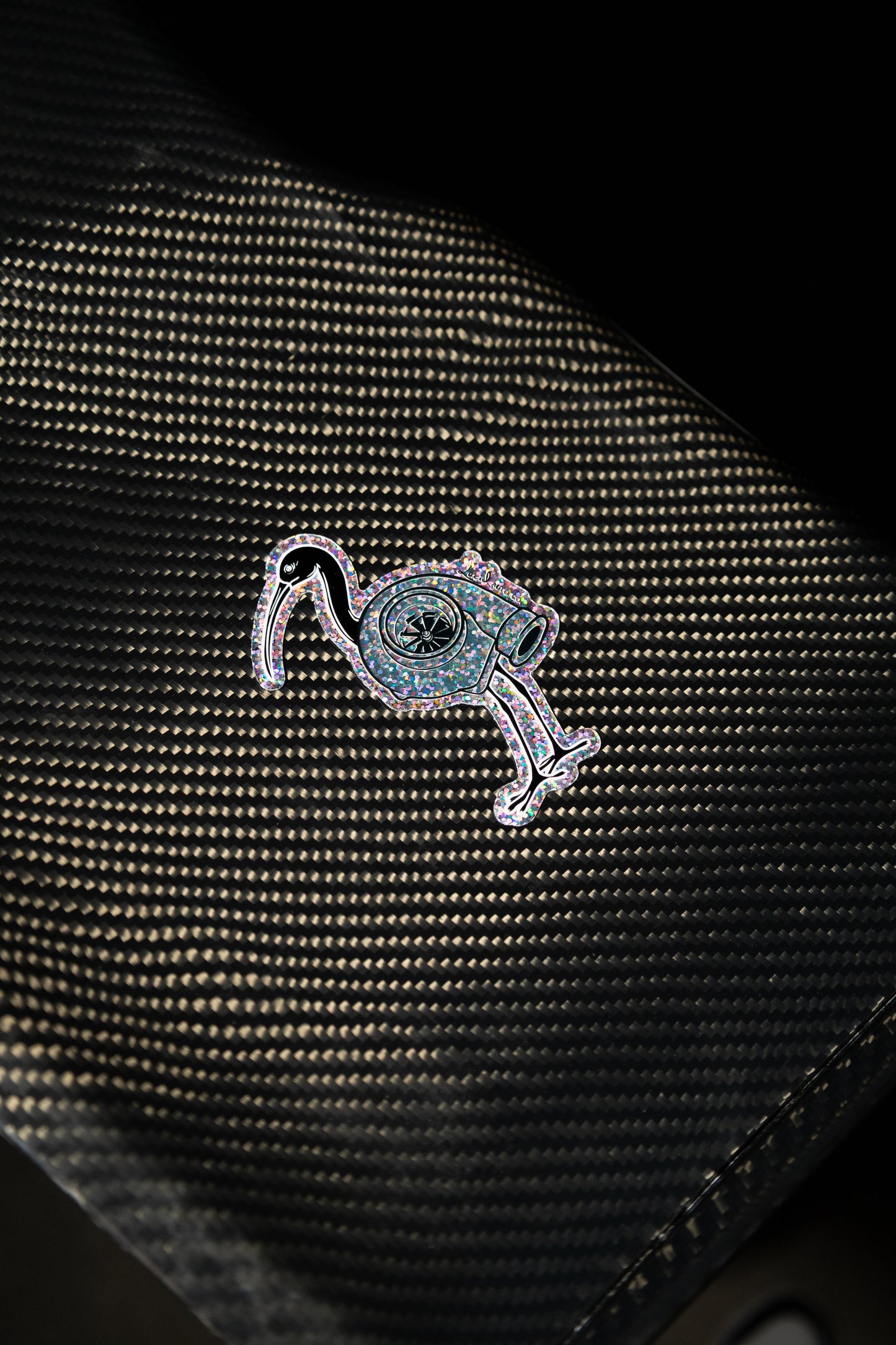 Close-up of glitter detail on Bin Chicken Turbo sticker – automotive accessory